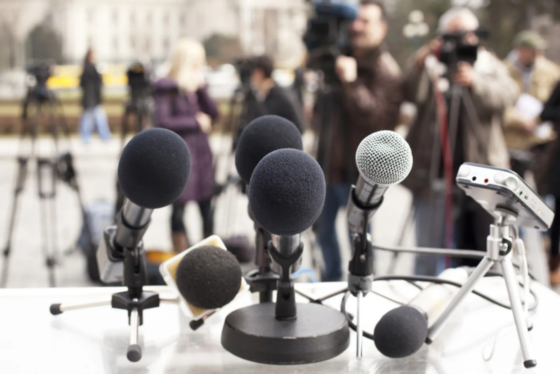 Microphones prepared for press conference during crisis communication planning in Northern California