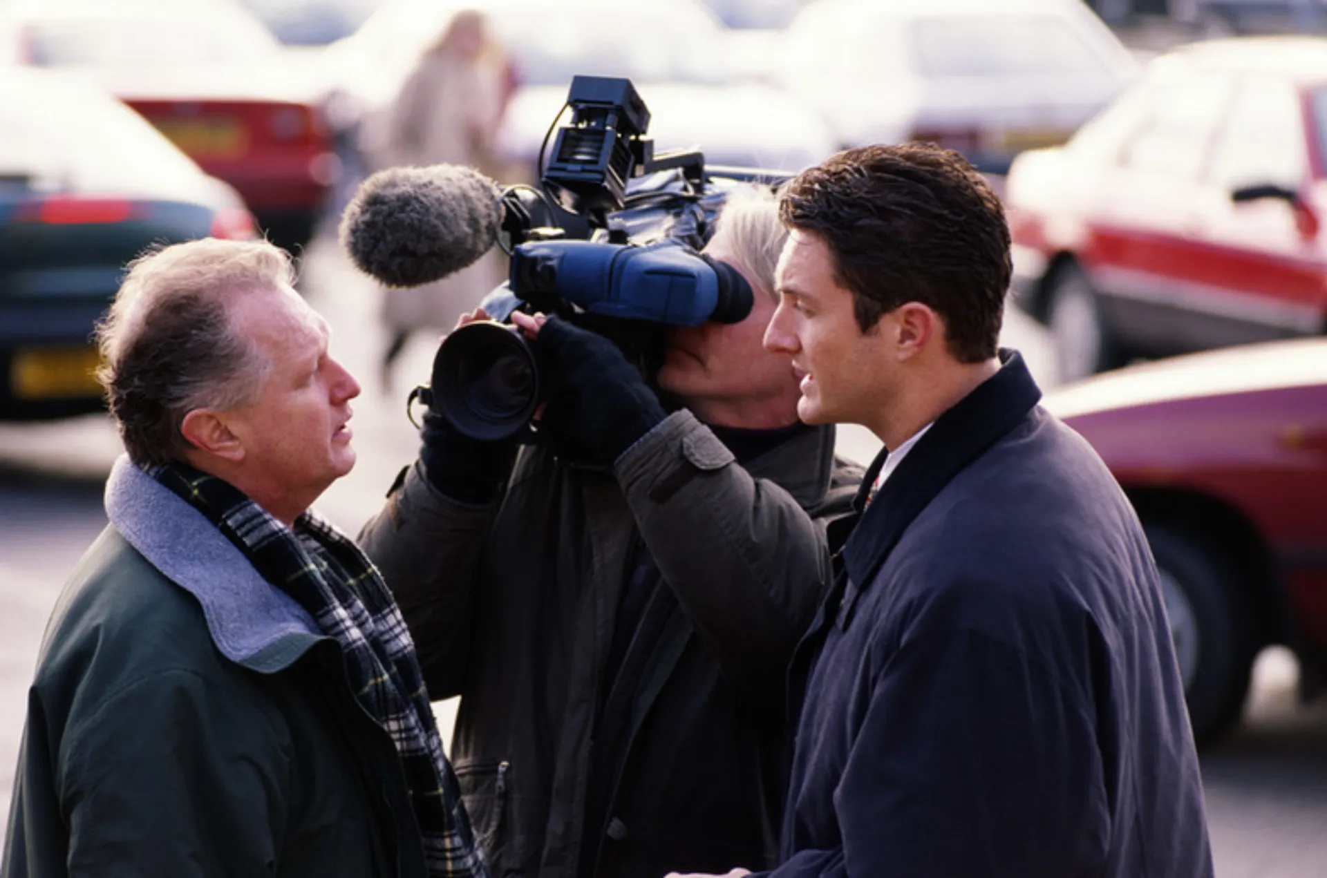 Executive speaking to news reporter during high profile crisis management incident in Northern California